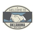 Business concept with handshake and the text Welcome to Oklahoma