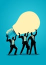 Businessmen lifting up a light bulb together