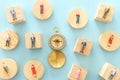 Business concept image of group of miniature people and compass. Metaphor of society structure and social issues Royalty Free Stock Photo