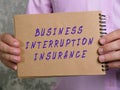 Business concept about BUSINESS INTERRUPTION INSURANCE with sign on the page