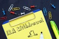 Business concept about IRA Withdrawal with sign on the sheet