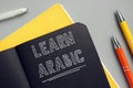 Business concept about LEARN ARABIC with inscription on the page