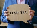 Business concept about LEARN THAI with sign on the page