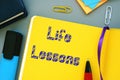 Business concept about Life Lessons with inscription on the sheet