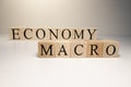 Business concept. Macro, economy, risk words are written with wooden cubes Royalty Free Stock Photo