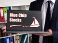 Business concept meaning Blue Chip Stocks with inscription on laptop