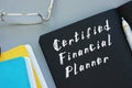 Business concept meaning Certified Financial Planner with phrase on the page