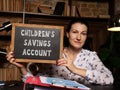 Business concept meaning CHILDREN`S SAVINGS ACCOUNT with sign on the black board Royalty Free Stock Photo
