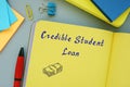 Business concept meaning Credible Student Loan with sign on the page