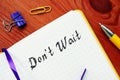 Business concept meaning Don`t Wait  with phrase on the piece of paper Royalty Free Stock Photo