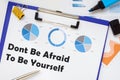 Business concept meaning Dont Be Afraid To Be Yourself with inscription on the piece of paper