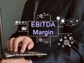 Business concept meaning EBITDA Margin with sign on the piece of paper