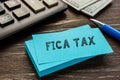 Business concept meaning FICA TAX Federal Insurance Contributions Act with sign on the page