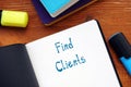 Business concept meaning Find Clients with phrase on the piece of paper Royalty Free Stock Photo