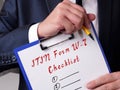 Business concept meaning Individual Taxpayer Identification Number ITIN Form W-7 Checklist with sign on the sheet
