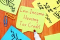 Business concept meaning Low-Income Housing Tax Credit with sign on the page