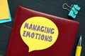 Business concept meaning MANAGING EMOTIONS with inscription on the page