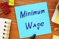 Business concept meaning Minimum Wage with sign on the page Royalty Free Stock Photo
