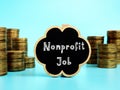 Business concept meaning Nonprofit Job with sign on the piece of paper