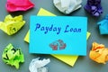 Business concept meaning Payday Loan with inscription on the piece of paper