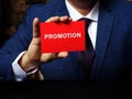 Business concept meaning PROMOTION with inscription on the piece of paper. Concept about advancement, forwarding and furtherance Royalty Free Stock Photo