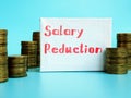 Business concept meaning Salary Reduction with sign on the piece of paper