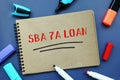 Business concept meaning SBA 7A LOAN Small Business Administration with sign on the piece of paper Royalty Free Stock Photo