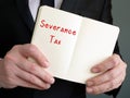 Business concept meaning Severance Tax with inscription on the piece of paper