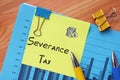 Business concept meaning Severance Tax with inscription on the sheet
