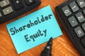 Business concept meaning Shareholder Equity with inscription on the sheet