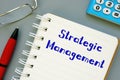 Business concept meaning Strategic Management with phrase on the page