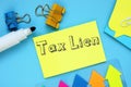 Business concept meaning Tax Lien with inscription on the sheet