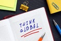 Business concept meaning THINK GLOBAL with phrase on the sheet. The leaders and managers should think ahead of their time, and
