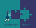 Business concept of mission completion, successful completion of a job or project.  The person sets the last part of the puzzle Royalty Free Stock Photo