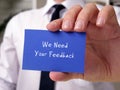 Business concept about We Need Your Feedback with inscription on the sheet Royalty Free Stock Photo