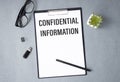 Business concept. Notebook with text confidential information sheet Royalty Free Stock Photo