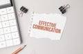 Business concept. Notebook with text effective communication sheet of white paper for notes, calculator, glasses, pencil, pen, in Royalty Free Stock Photo