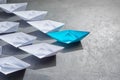 Business Concept, Paper Boat, the key opinion Leader, the concept of influence. One blue paper boat as the Leader