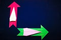 Business concept with paper plane and colored arrows on dark blue background Royalty Free Stock Photo