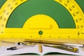 Business concept: pencil, compass, notebook, ruler, caliper and green chalkboard with protractor. Royalty Free Stock Photo