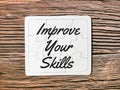 Phrase improve your skills written on puzzle board.