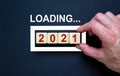 Business concept of planning 2021. Loading new year 2021 with hand putting wood cube in progress bar. Business concept. Beautiful Royalty Free Stock Photo