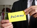 Business concept about Policies with inscription on the sheet