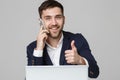 Business Concept - Portrait Handsome Business man showing thump up and smiling confident face in front of his laptop. White Backgr Royalty Free Stock Photo