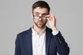 Business Concept - Portrait of a handsome businessman in suit with glasses serious thinking with stressful facial Royalty Free Stock Photo