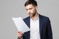 Business Concept - Portrait of a handsome businessman in suit with glasses serious thinking with stressful facial expression. Isol Royalty Free Stock Photo