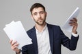 Business Concept - Portrait Handsome Business man serious working with annual report. isolated White Background. Copy space.