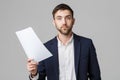 Business Concept - Portrait Handsome Business man serious working with annual report. isolated White Background. Copy space.