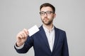 Business Concept - Portrait Handsome Business man showing name card with smiling confident face. White Background.Copy Royalty Free Stock Photo