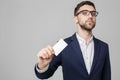 Business Concept - Portrait Handsome Business man showing name card with smiling confident face. White Background.Copy Space. Royalty Free Stock Photo